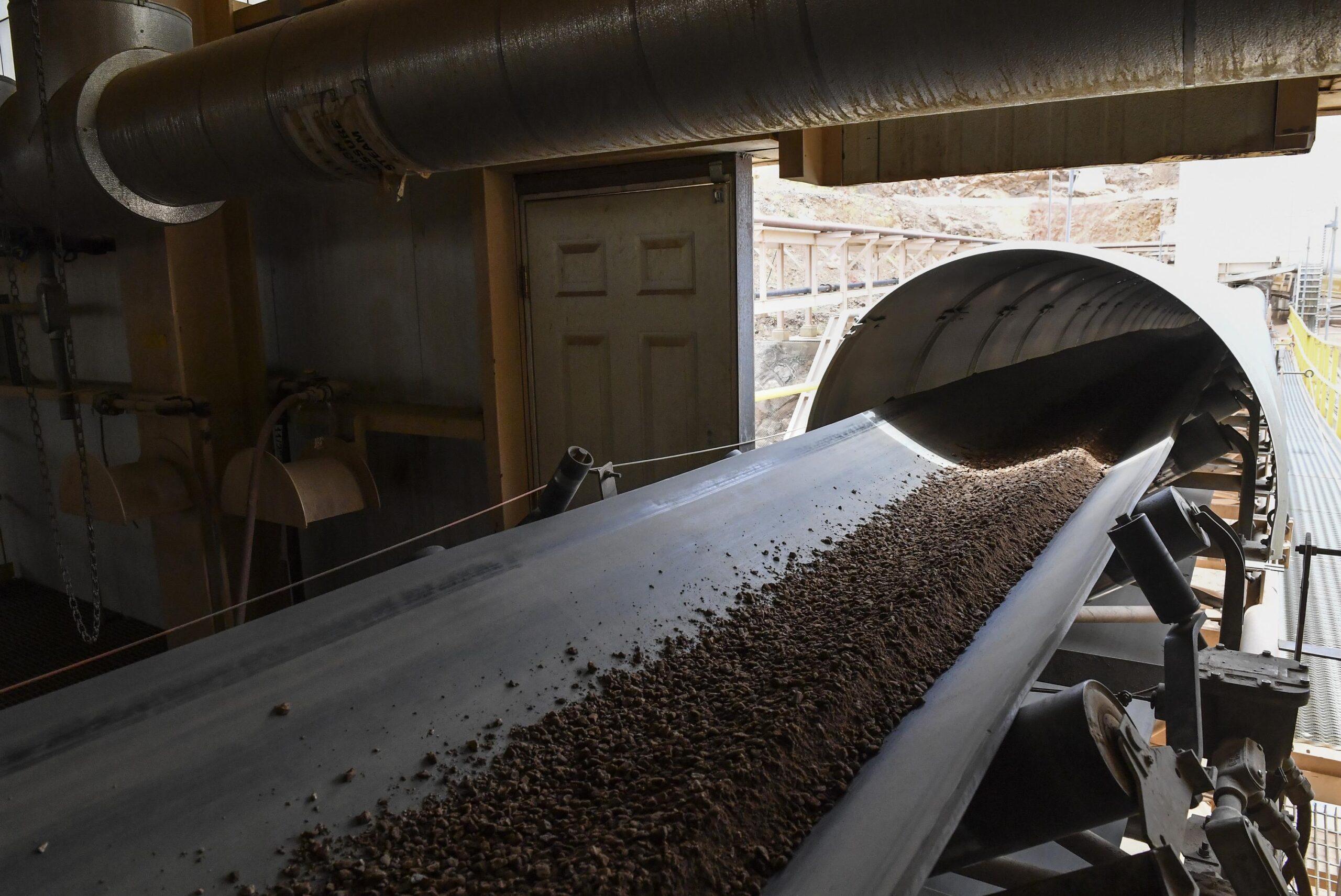 Mountain Pass Mine's rare earths product flows down a conveyor belt, ultimately headed for a processing facility in China. MUST CREDIT: Washington Post photo by Ricky Carioti